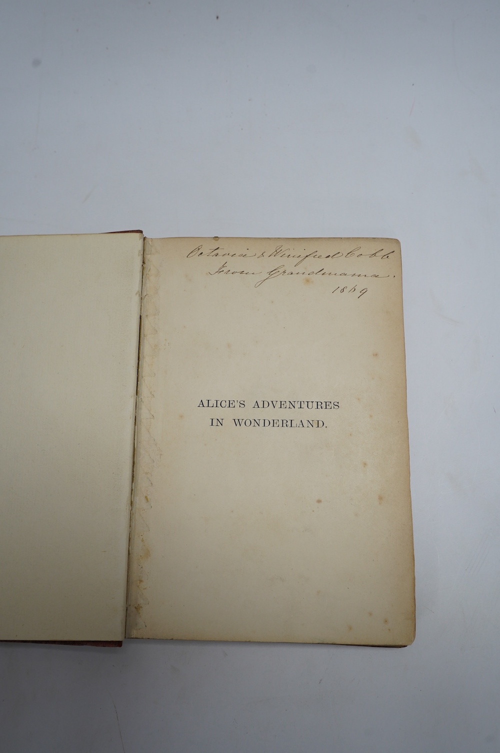 [Dodgson, Charles Lutwidge] - Alice's Adventures in Wonderland. By Lewis Carroll ... sixteenth thousand. frontis. and 41 engraved text illus. (by John Tenniel), half title; original gilt ruled and pictorial red cloth, so